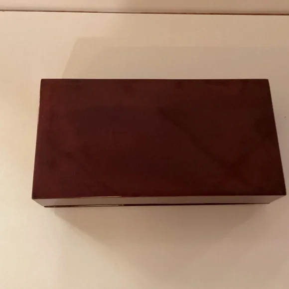 Vintage lacquered smoking box with mother of pearl inlay.